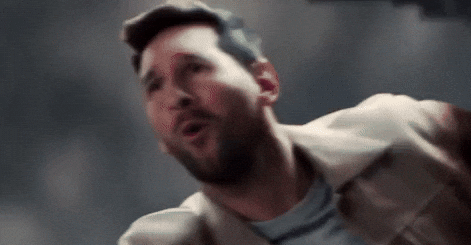Man singing passionately with dramatic expression.
